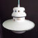 Old enamelled sheet metal suspension with glass cup
