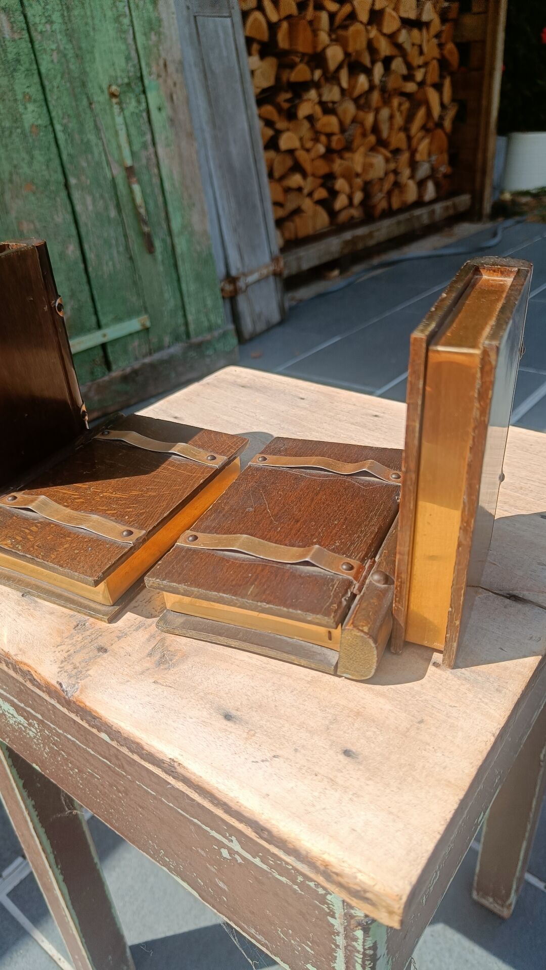 Wooden trompe-l'œil bookends with a book and box
