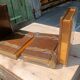 Wooden trompe-l'œil bookends with a book and box