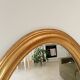 Miroir vintage ovale en bois doré années 60 77*41 cm