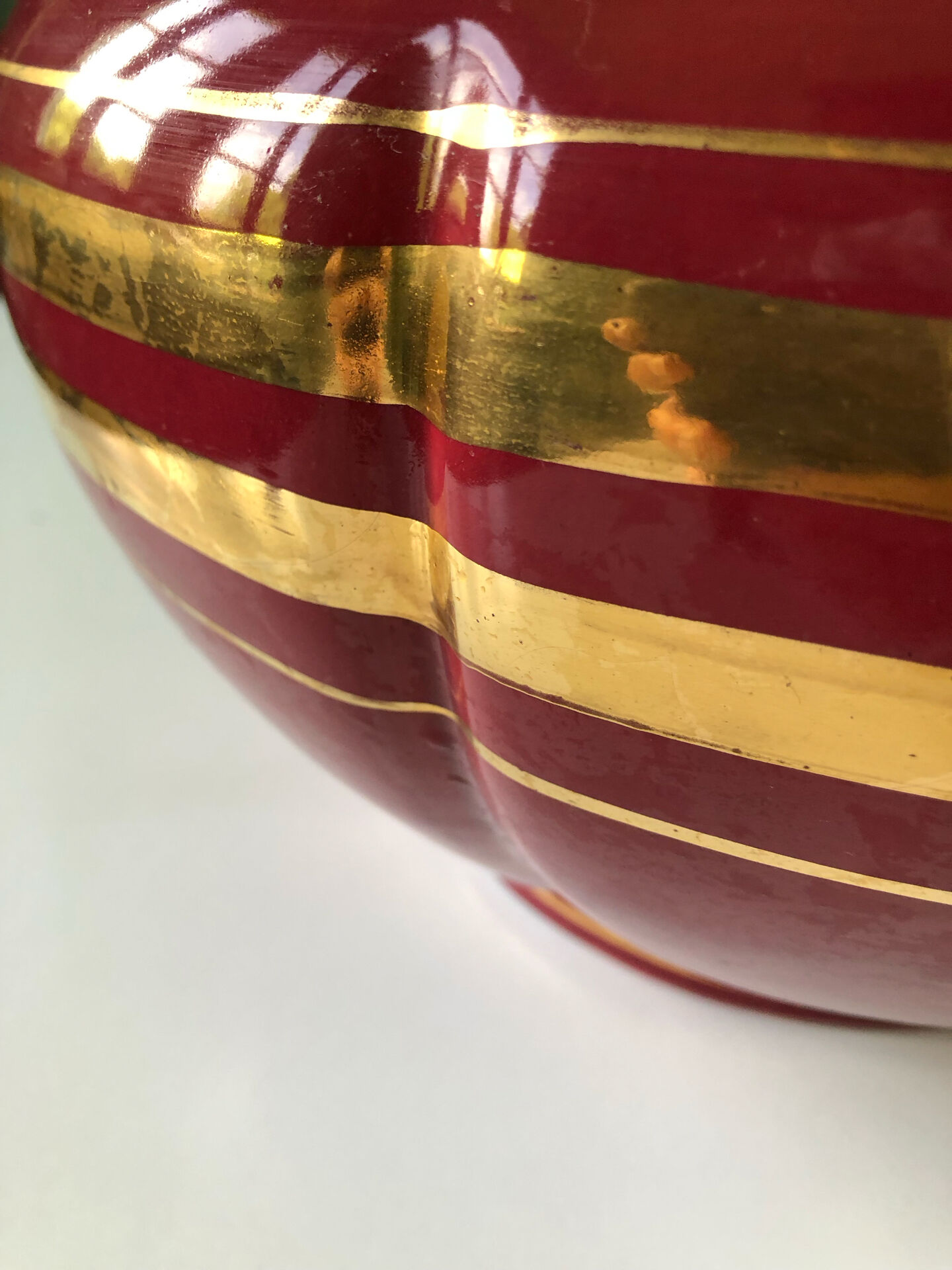 Large burgundy and gold vase