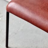 Pair of vintage stacking chairs with red vinyl upholstery