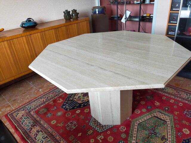 Octagonal dining table in travertine
