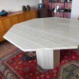 Octagonal dining table in travertine