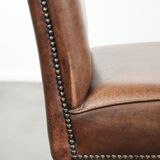 Set of 2 characterful dining chairs of sheepskin leather with a high back