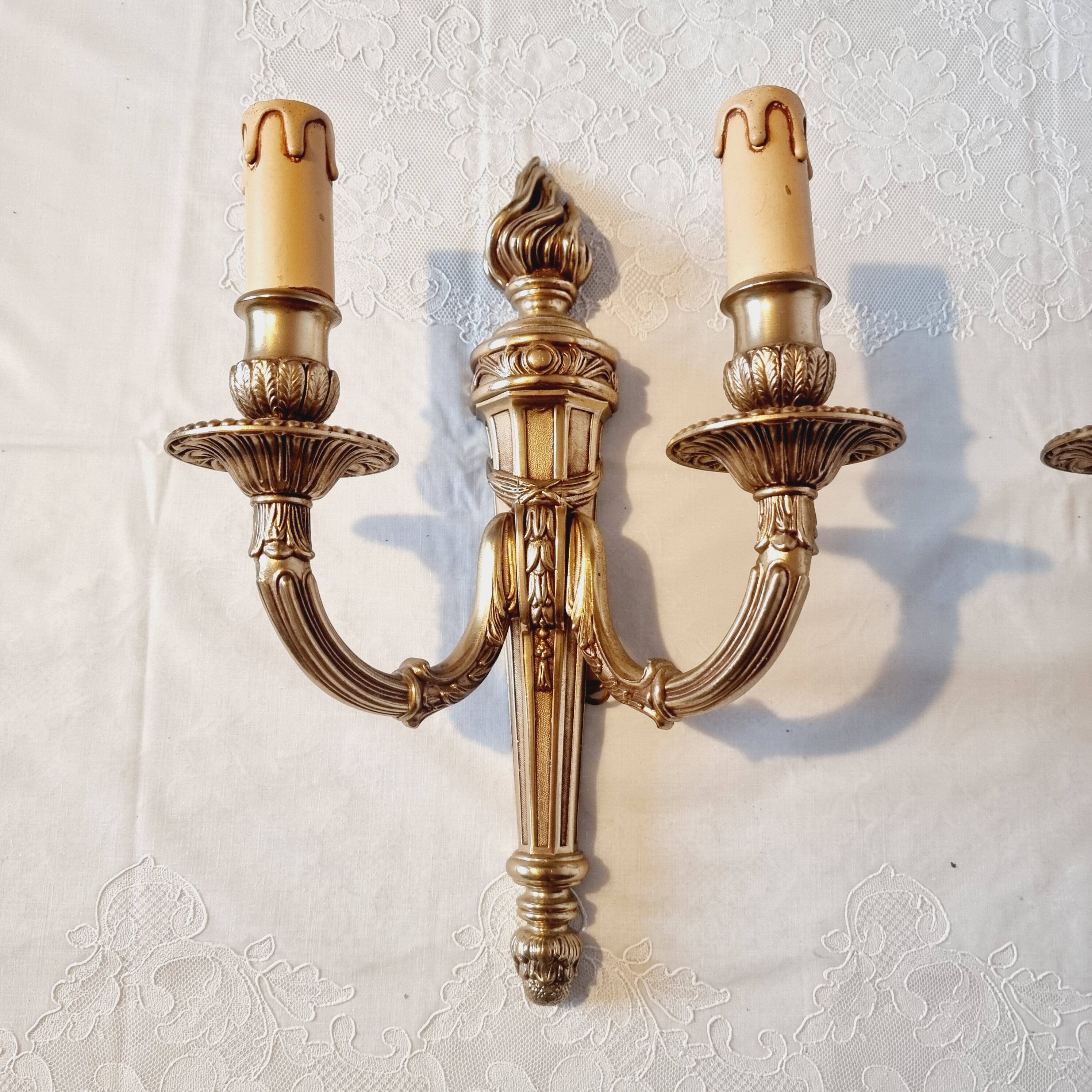 Pair of Louis XV style rocaille two-armed sconces in gilded bronze