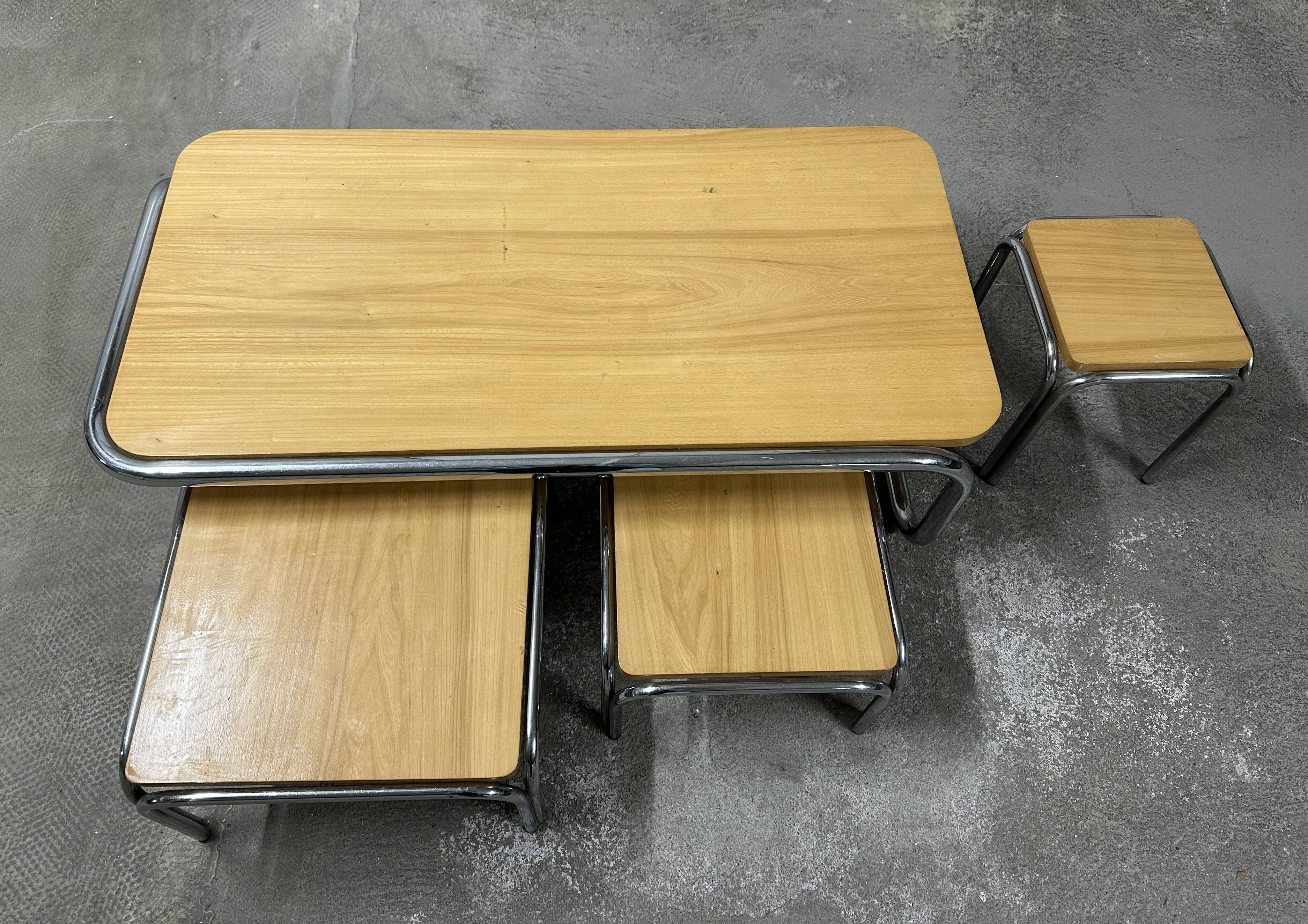Set of 4 nesting coffee tables from the 70s, metal and solid oak.