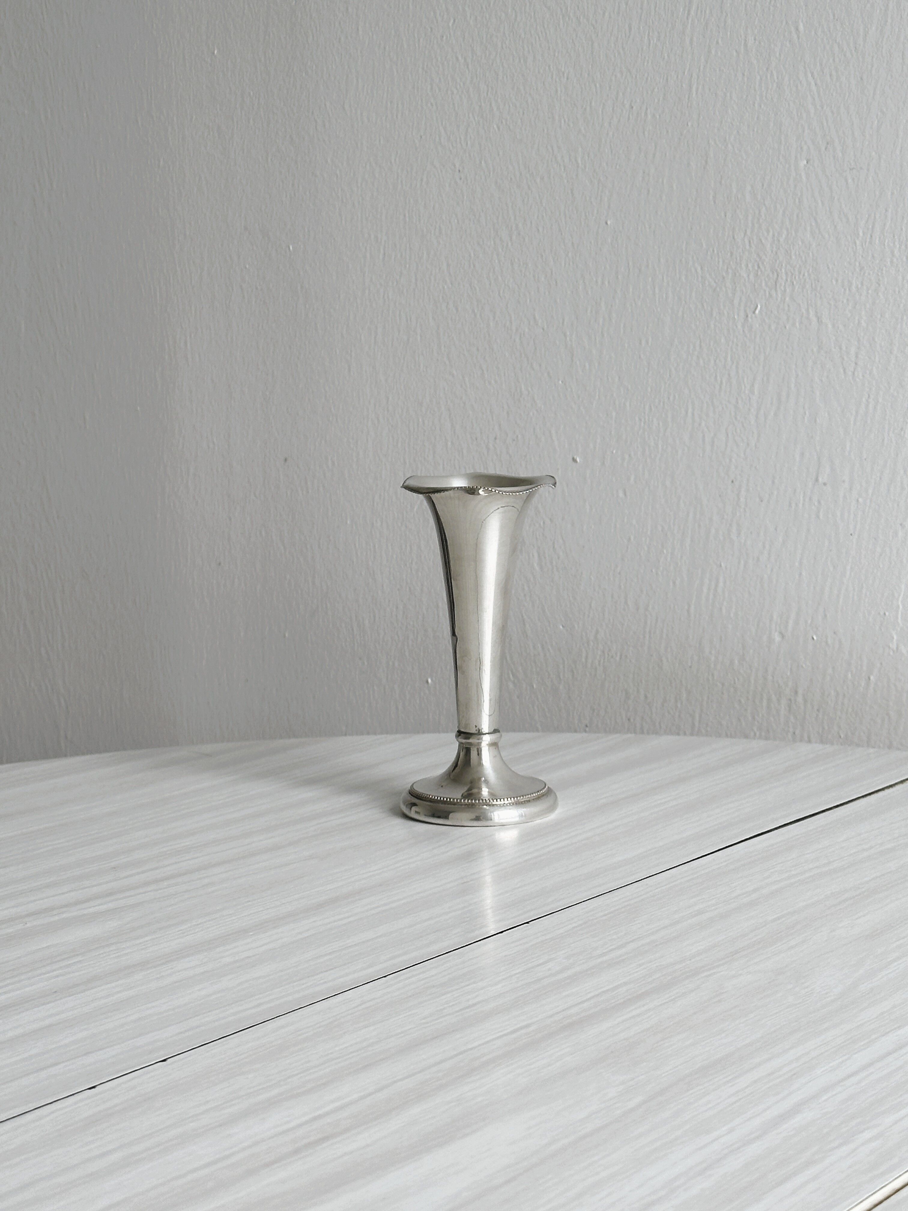 small antique silver-plated metal vase