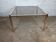 Square coffee table with gold chrome and smoked glass from the 1970s.