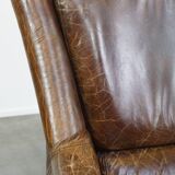Grained cowhide armchair with a timeless design