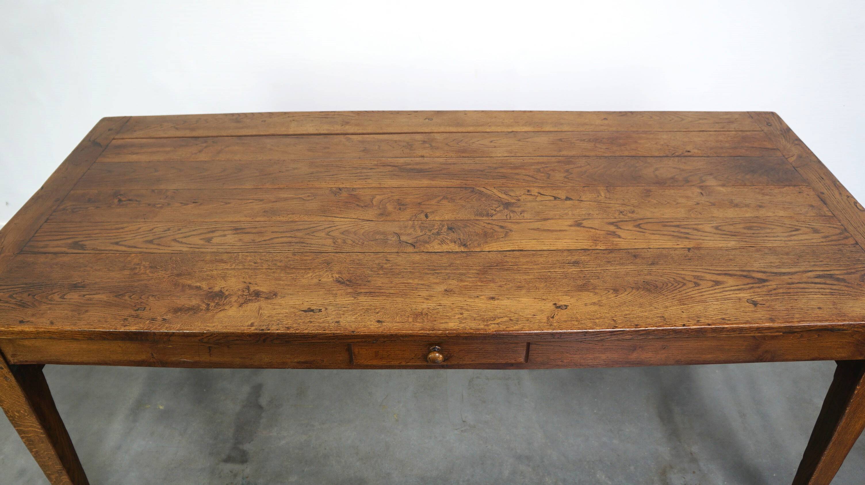 antique French oak dining table with 3 drawers and an exquisite patina