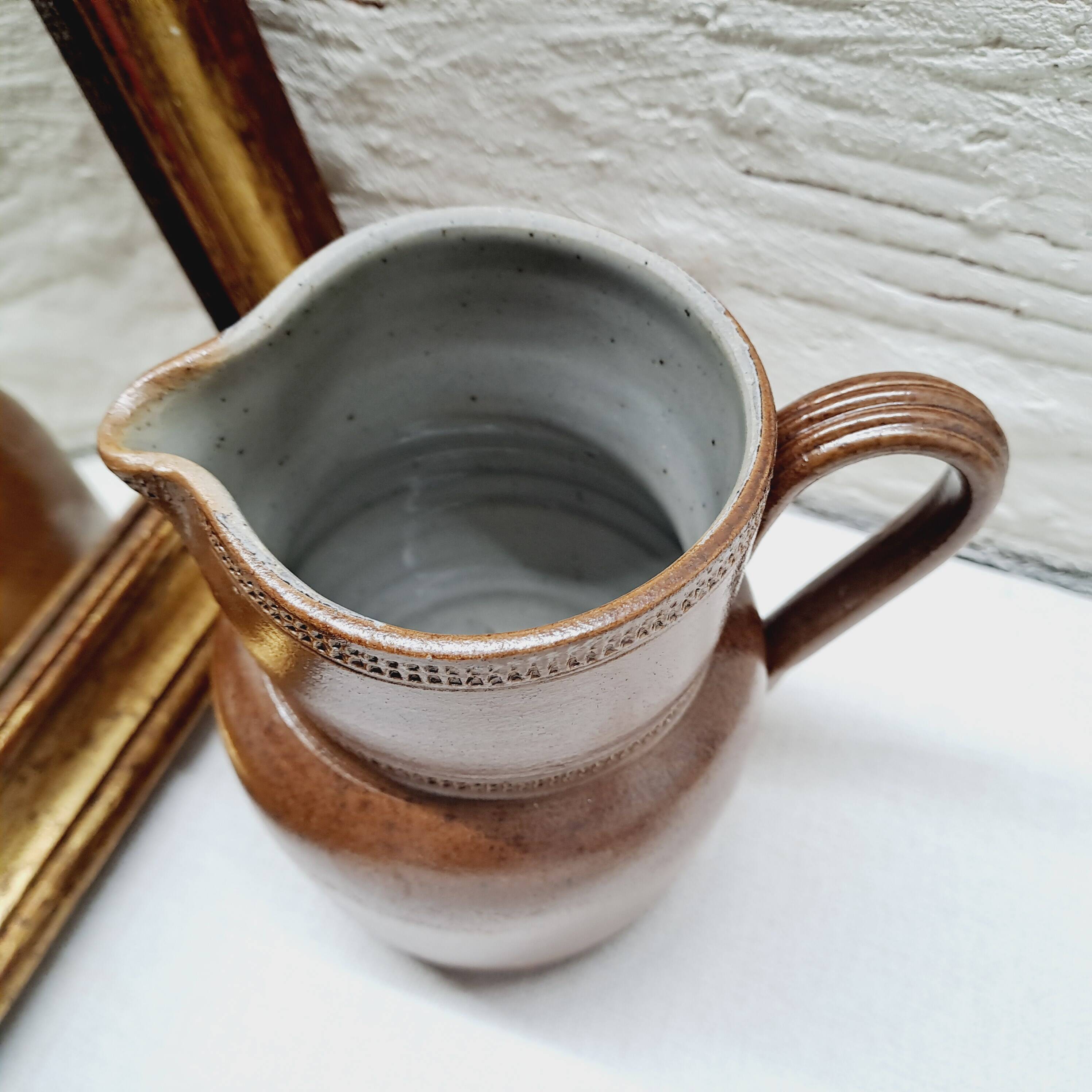 Antique stoneware milk jug