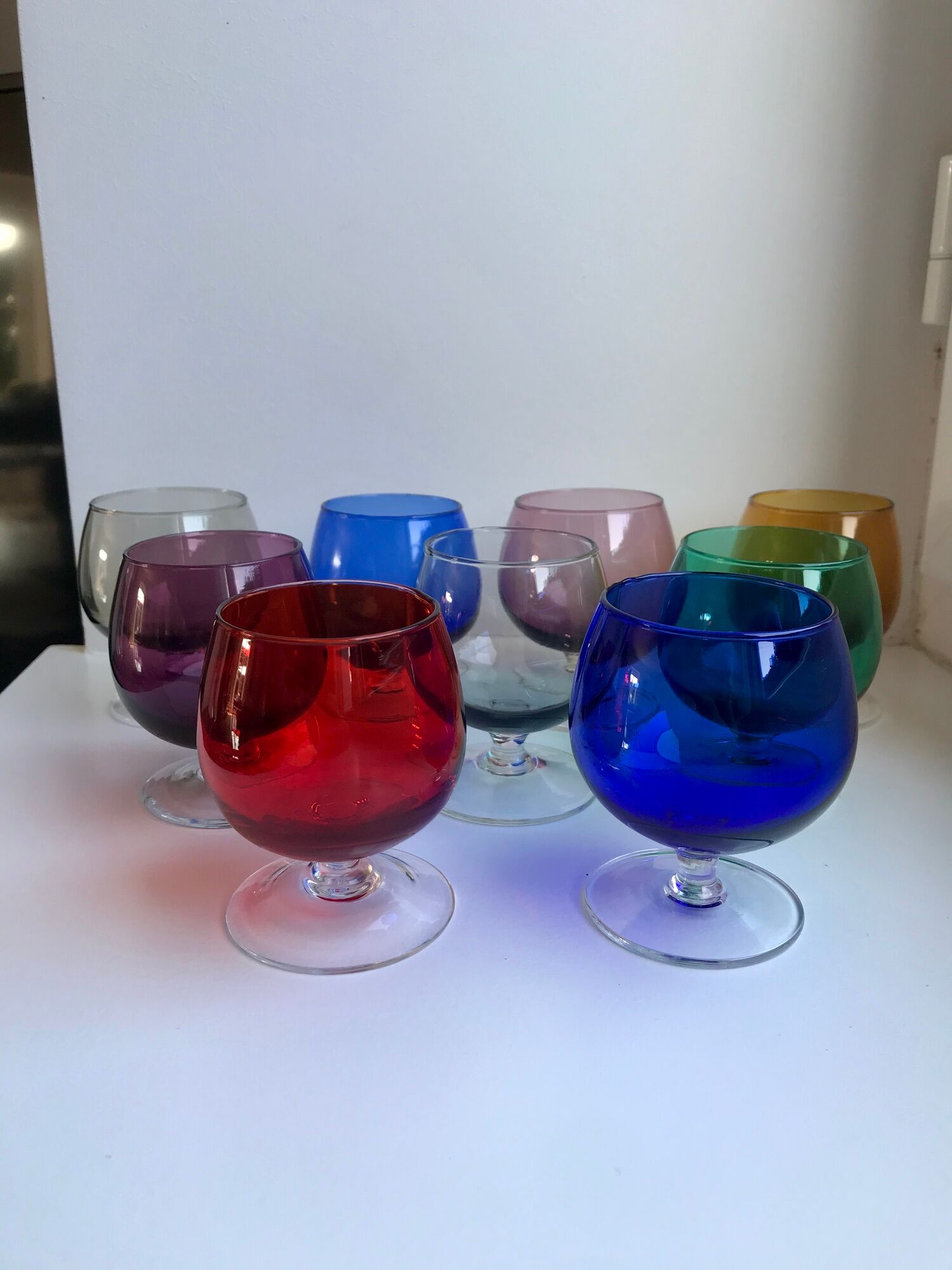 Set of 9 glasses with colored feet in blown glass 50s