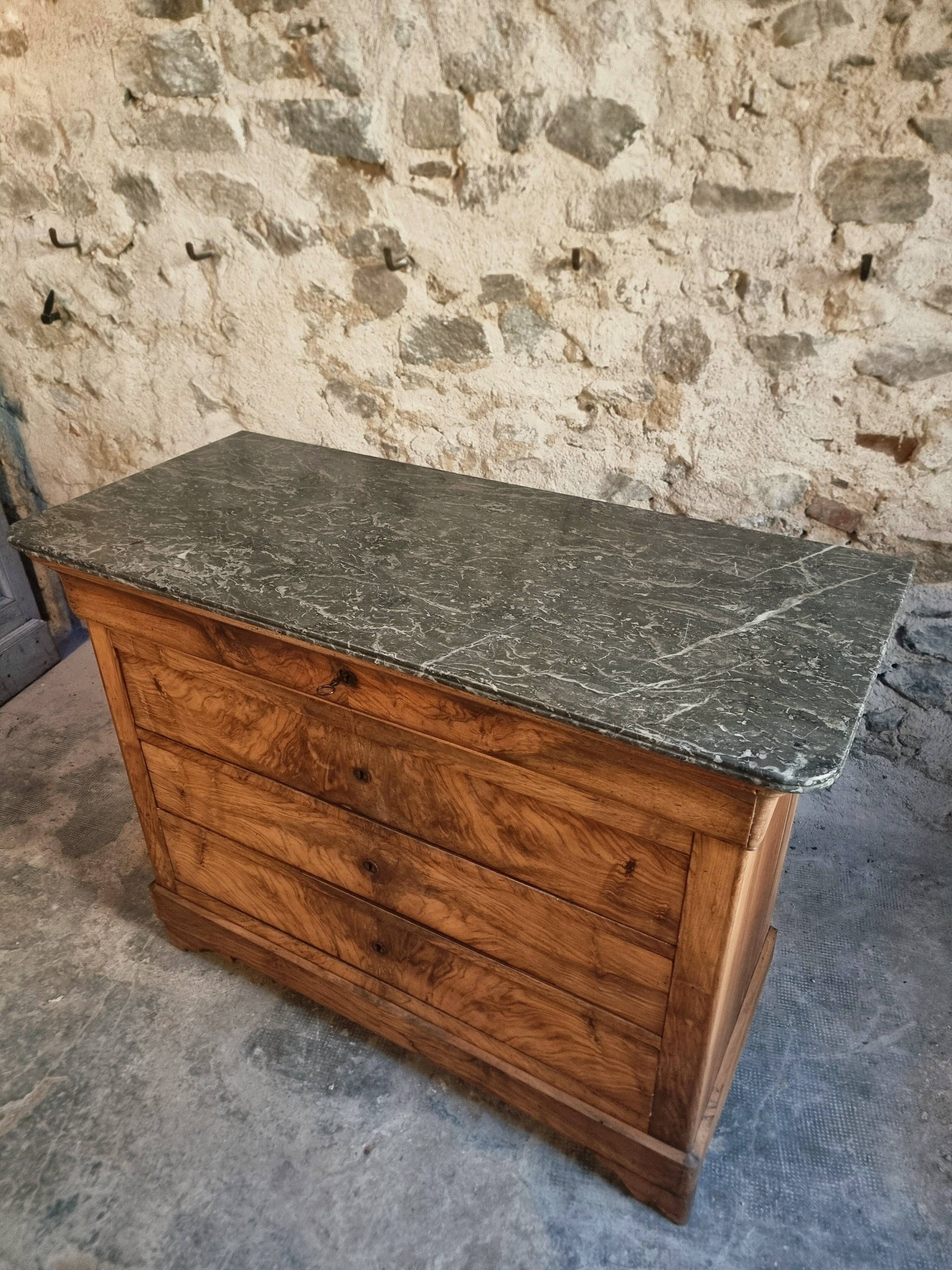 French antique walnut commode with a dark grey marble top, circa 1830–1860.