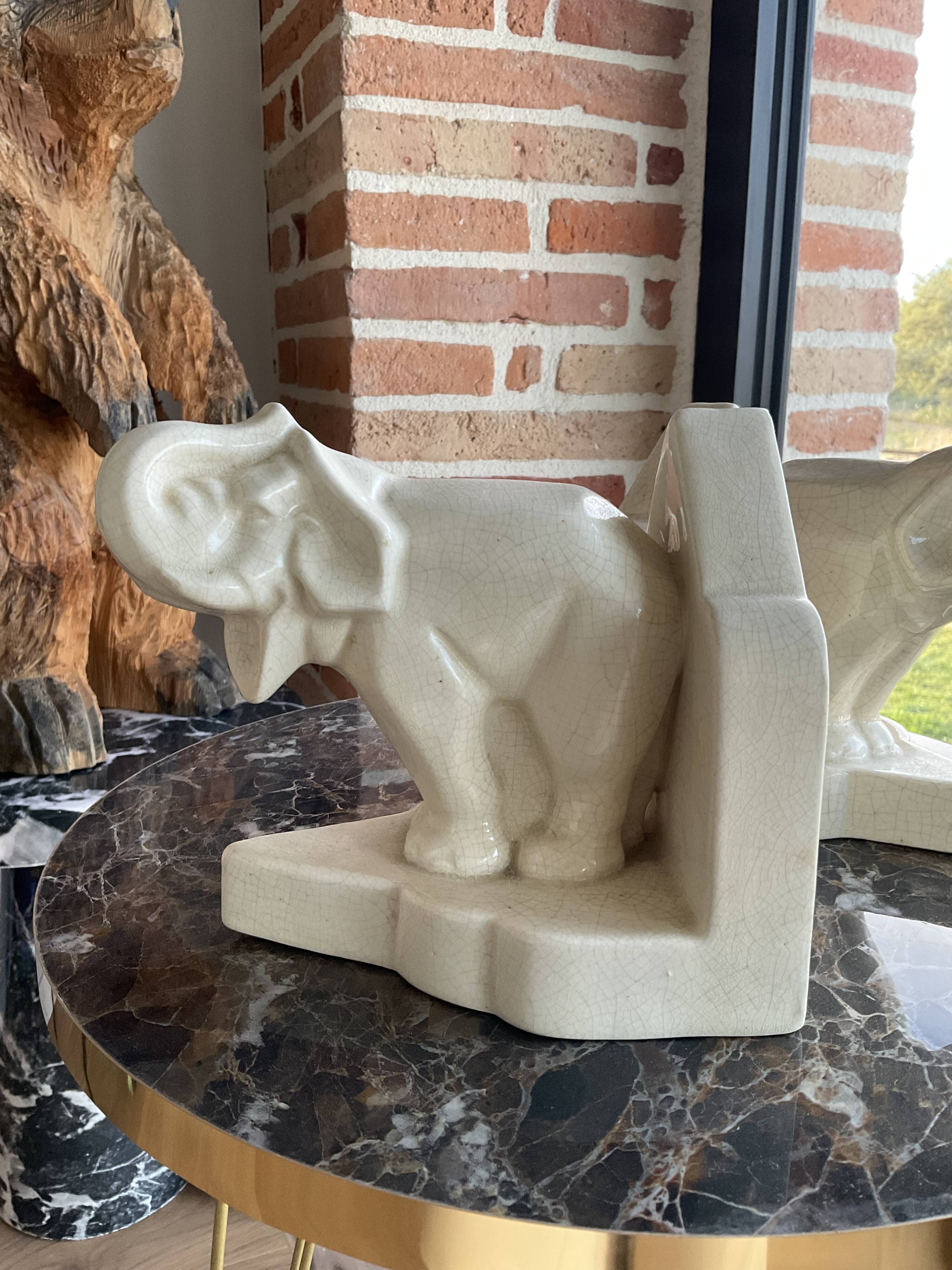 Pair of cracked earthenware bookends. ART DECO