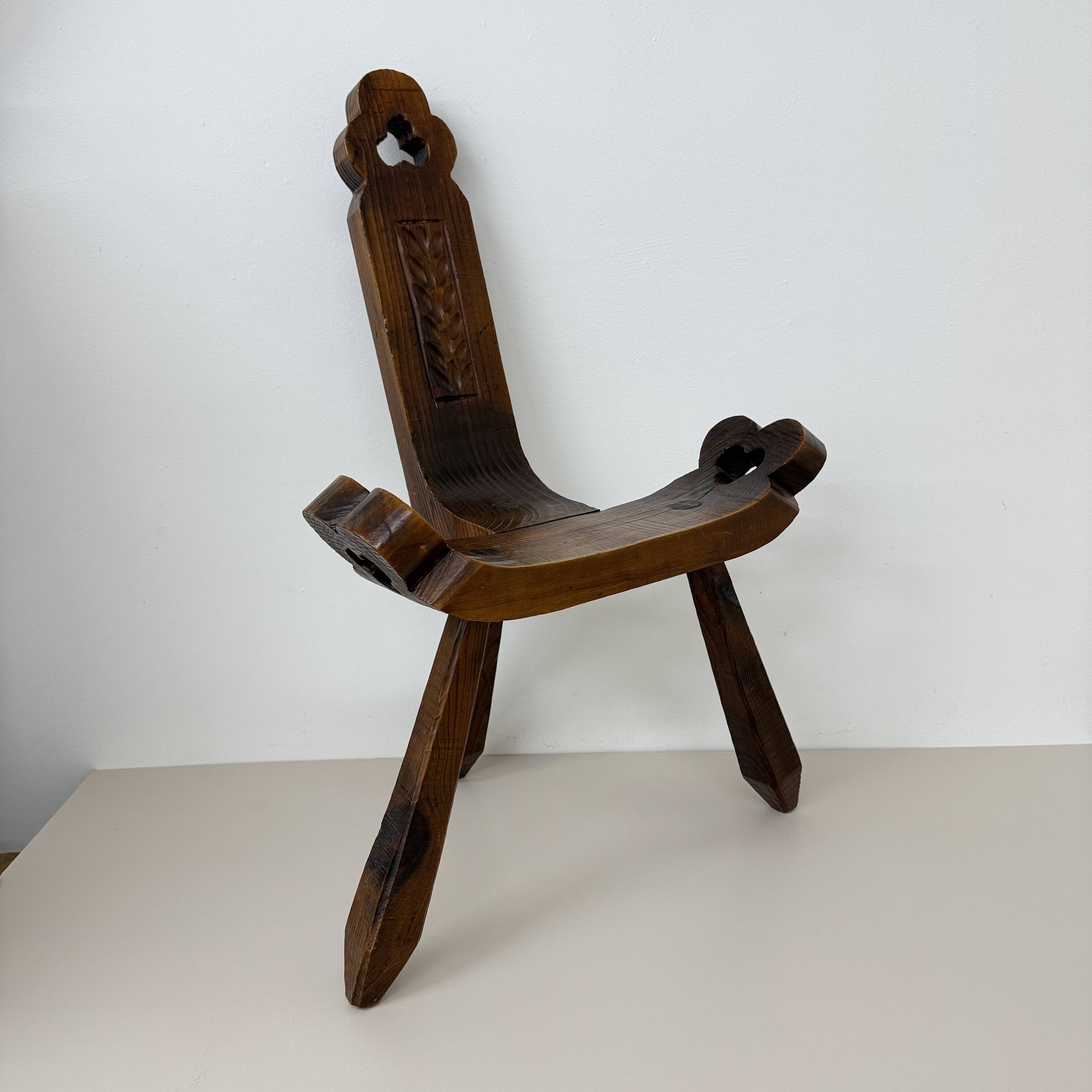 Brutalist hand carved oak Spanish tripod chair , 1970s