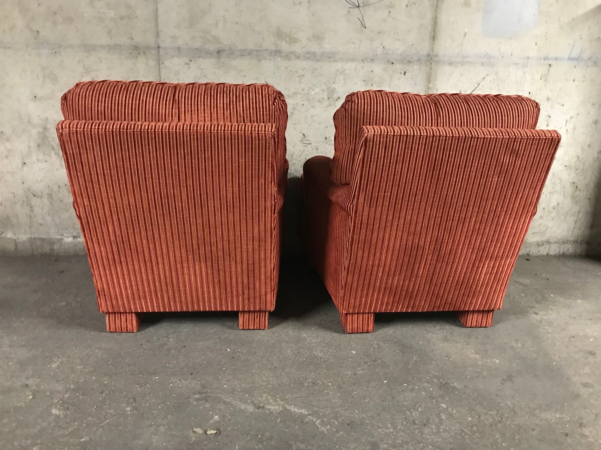 Pair of club in red velvet armchairs Yves Halard