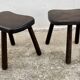 Pair of vintage stained wood tripod stools from the 1970s