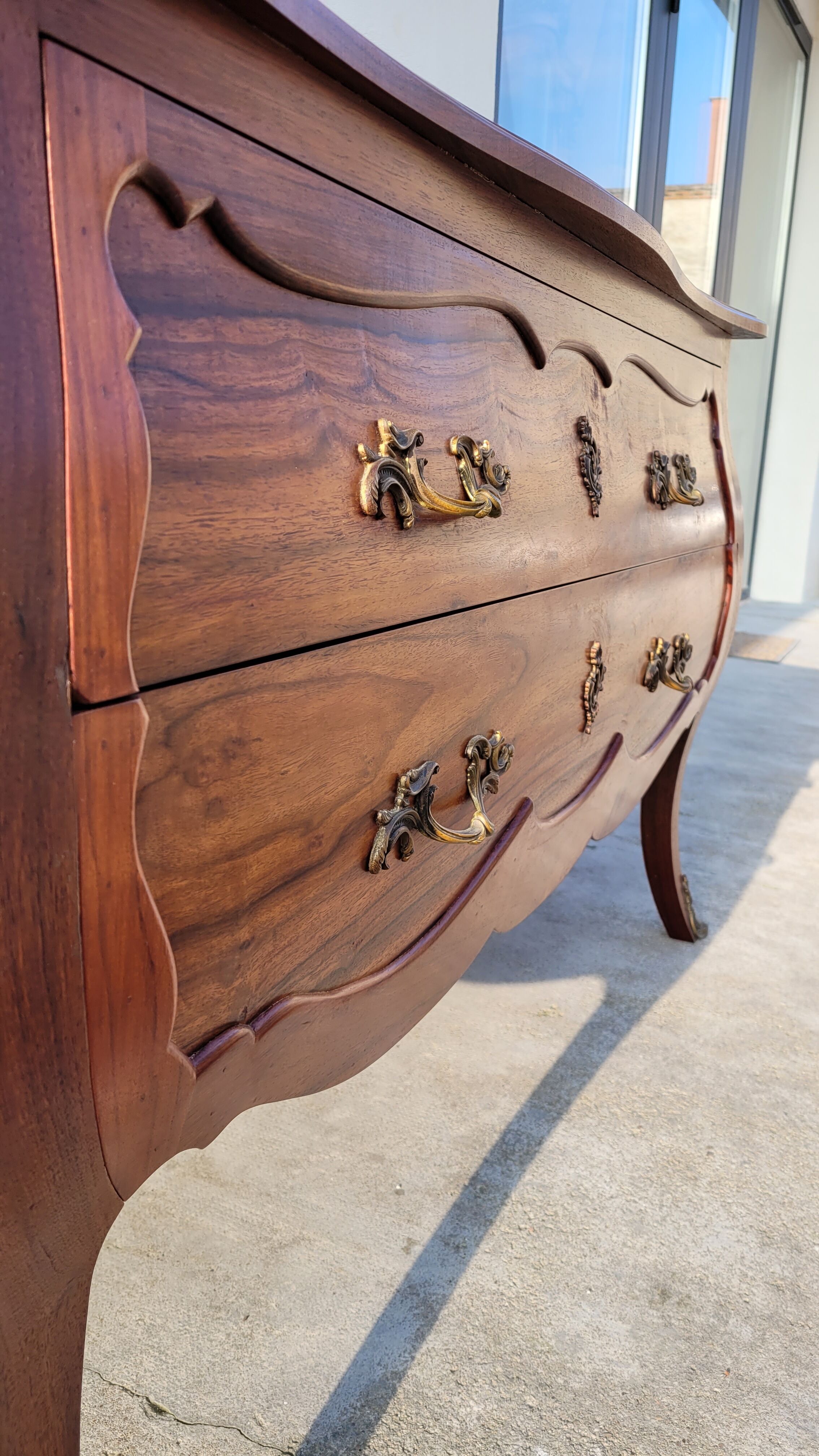 Curved Louis XV style commode in mahogany.