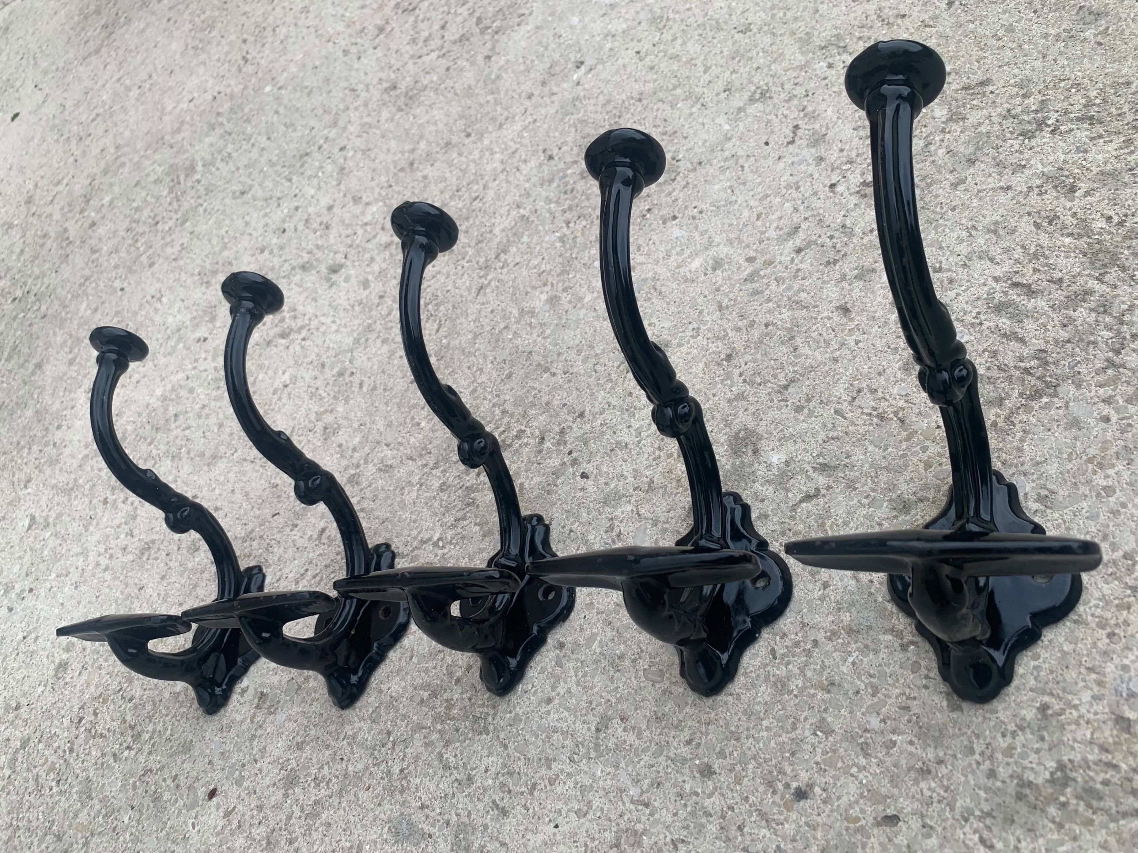 Set of 5 old cast iron hooks
