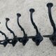 Set of 5 old cast iron hooks