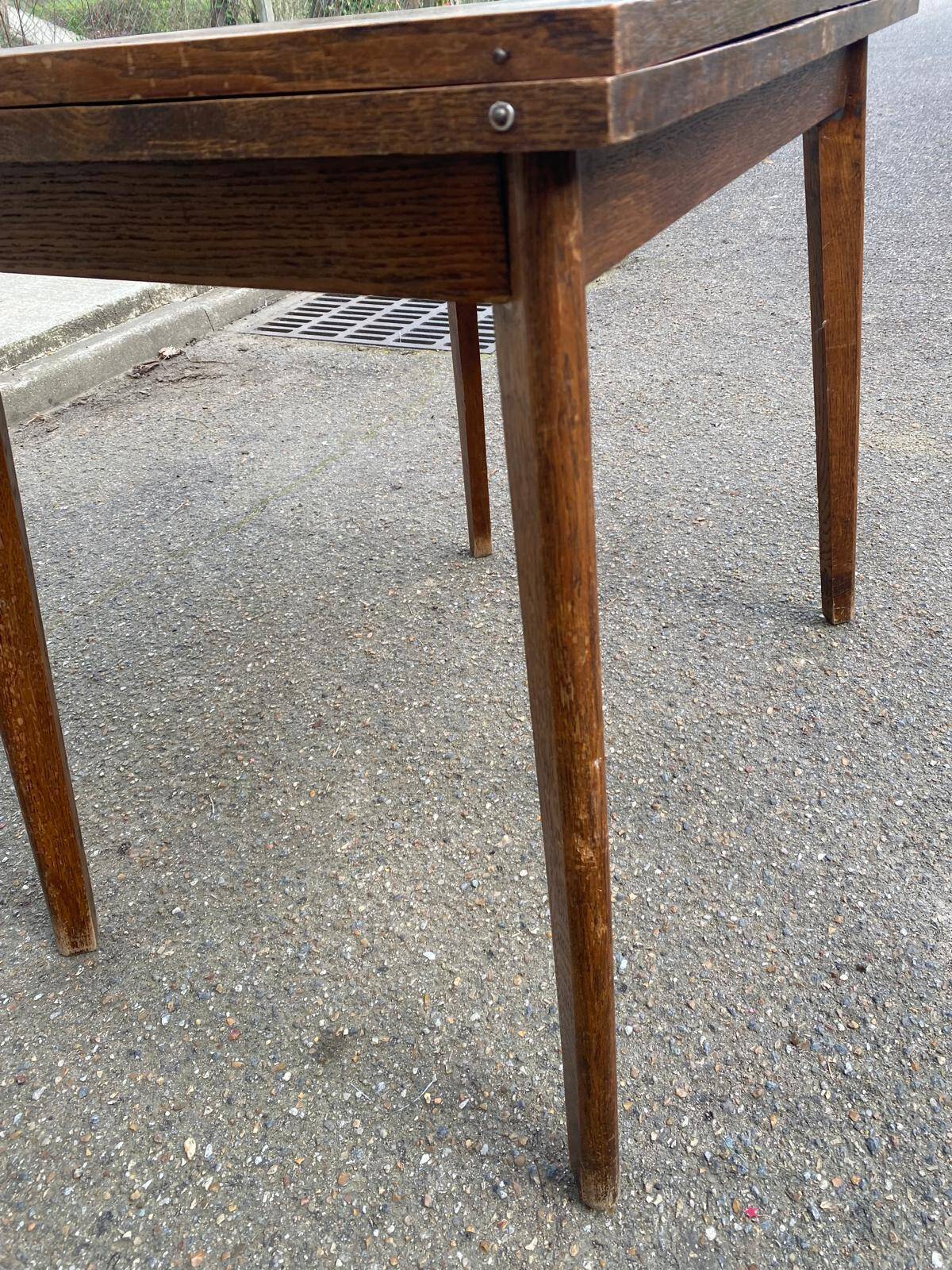 Scandinavian extendable dining table with storage in 19th-century oak.
