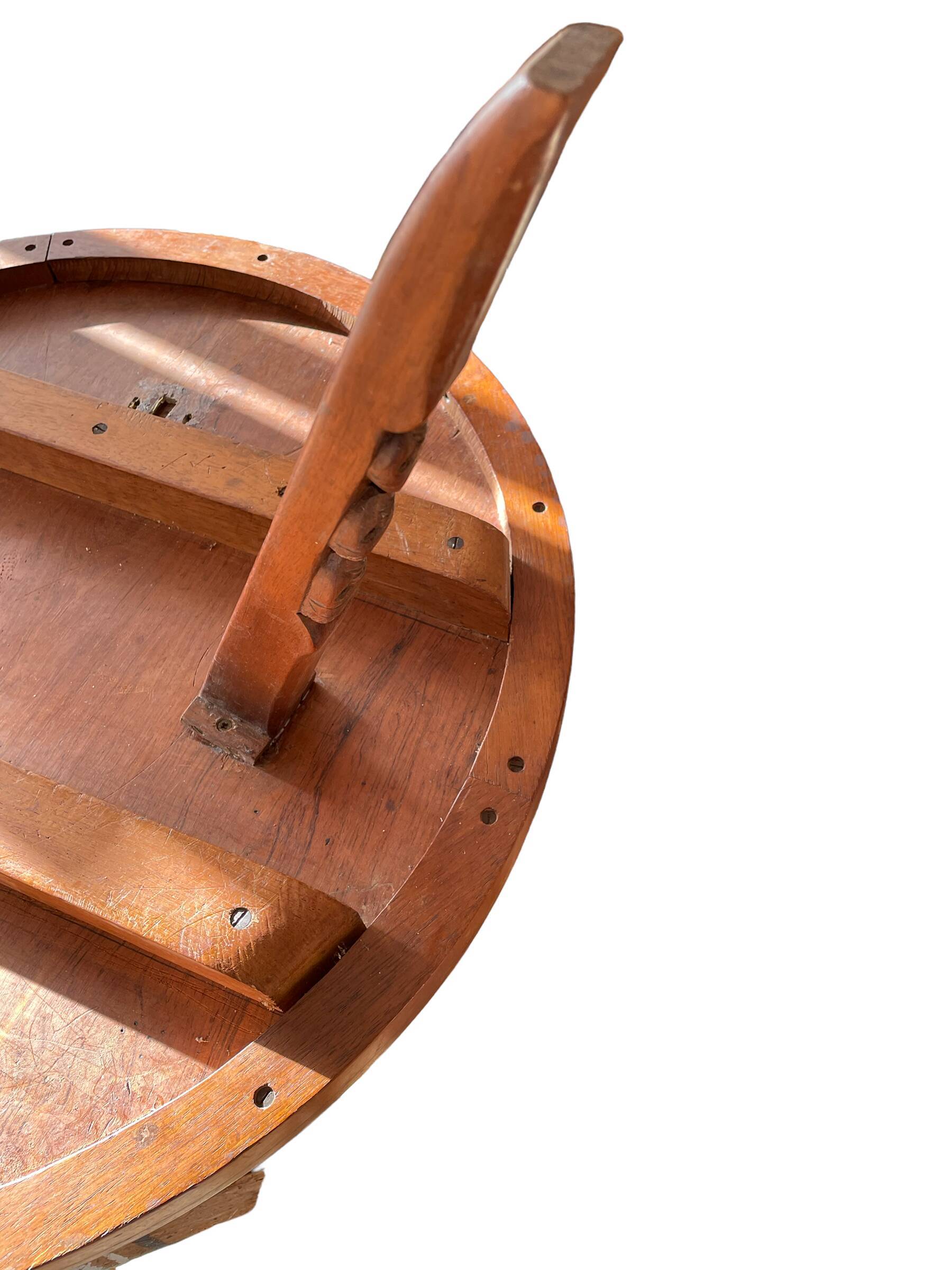 Circular tripod coffee table in carved wood