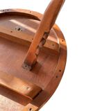 Circular tripod coffee table in carved wood