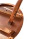 Circular tripod coffee table in carved wood