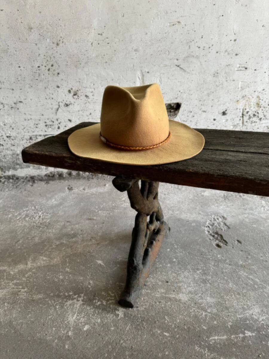 Dark brown wood and black cast-iron antique garden bench with weathered solid-wood seat