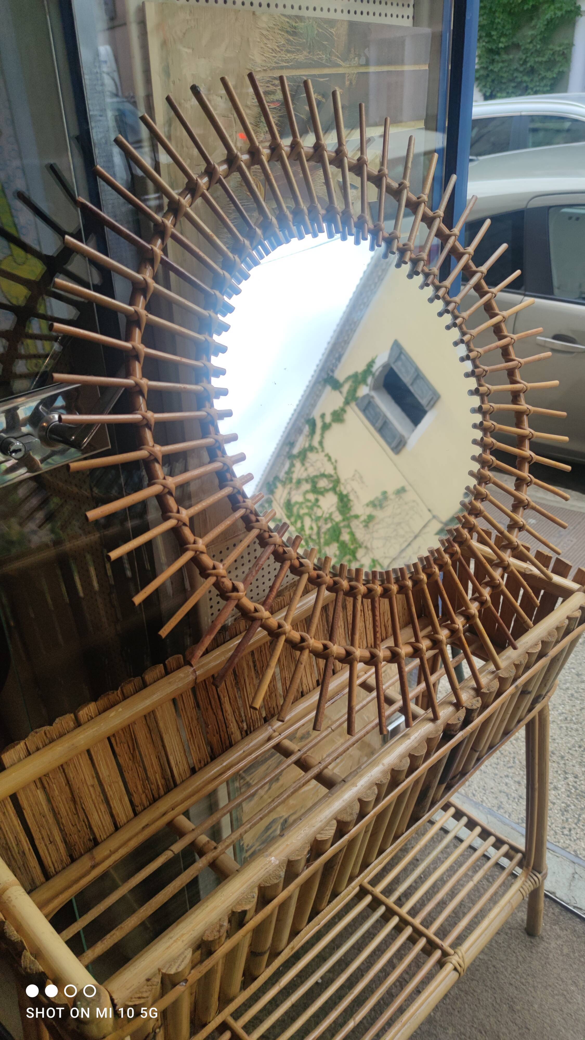 Rattan sunburst mirror, circa 1960, 72 cm in diameter