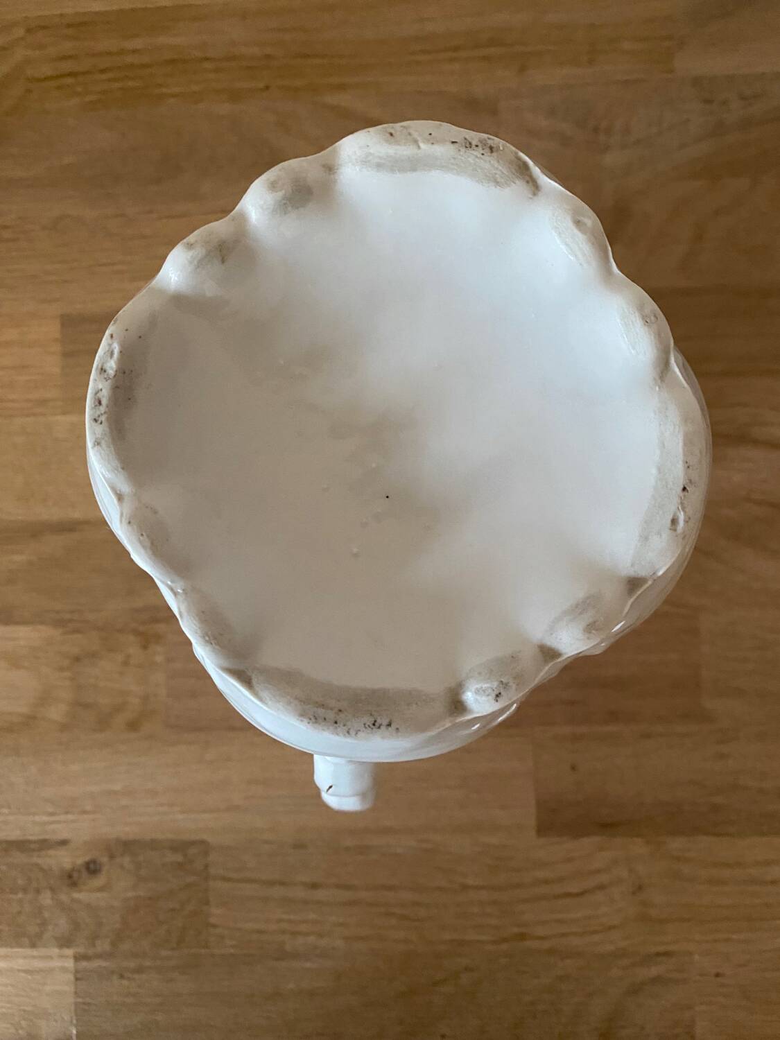 Old ceramic pitcher decorated with flowers