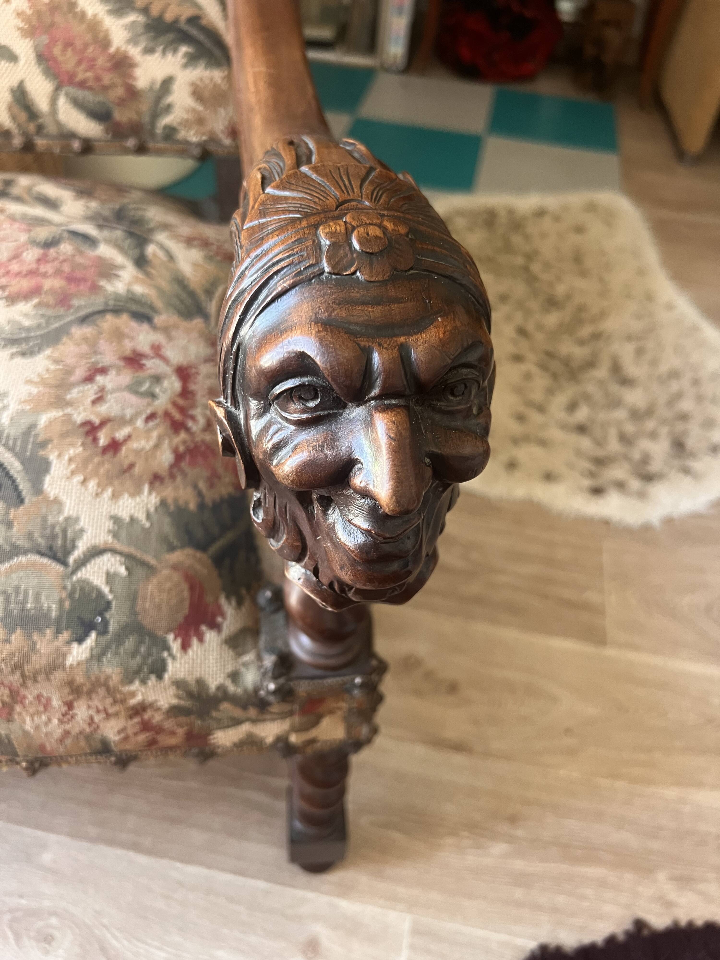 Antique armchair in Henri II style with masks