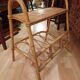Small side piece of furniture with bamboo magazine holder, wooden top, 1960