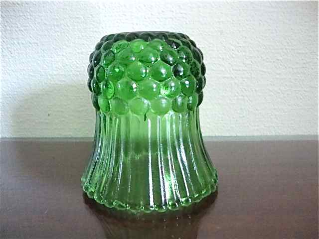 Very small green vase bottle
