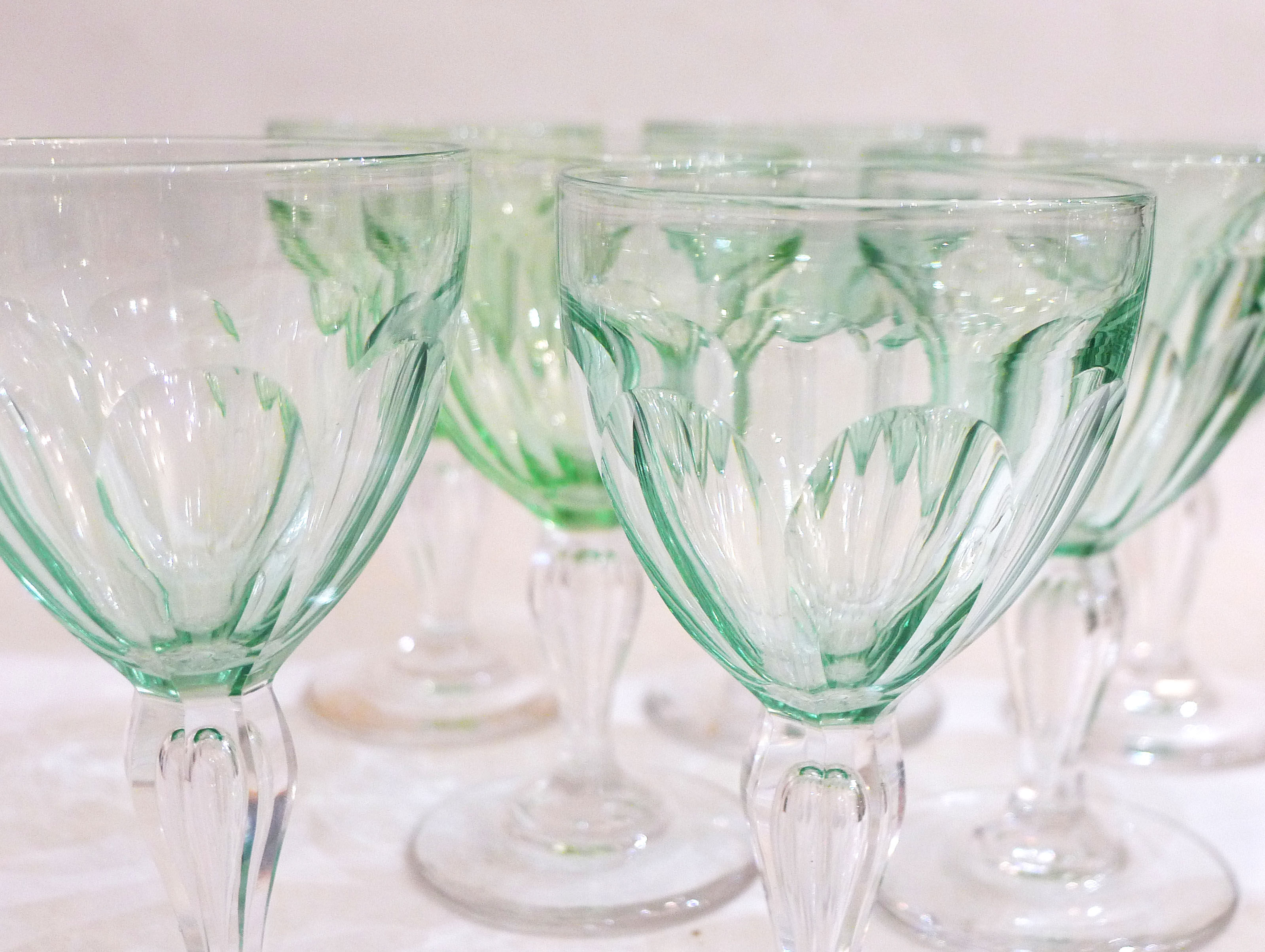 Set of nine glasses on foot in cut glass