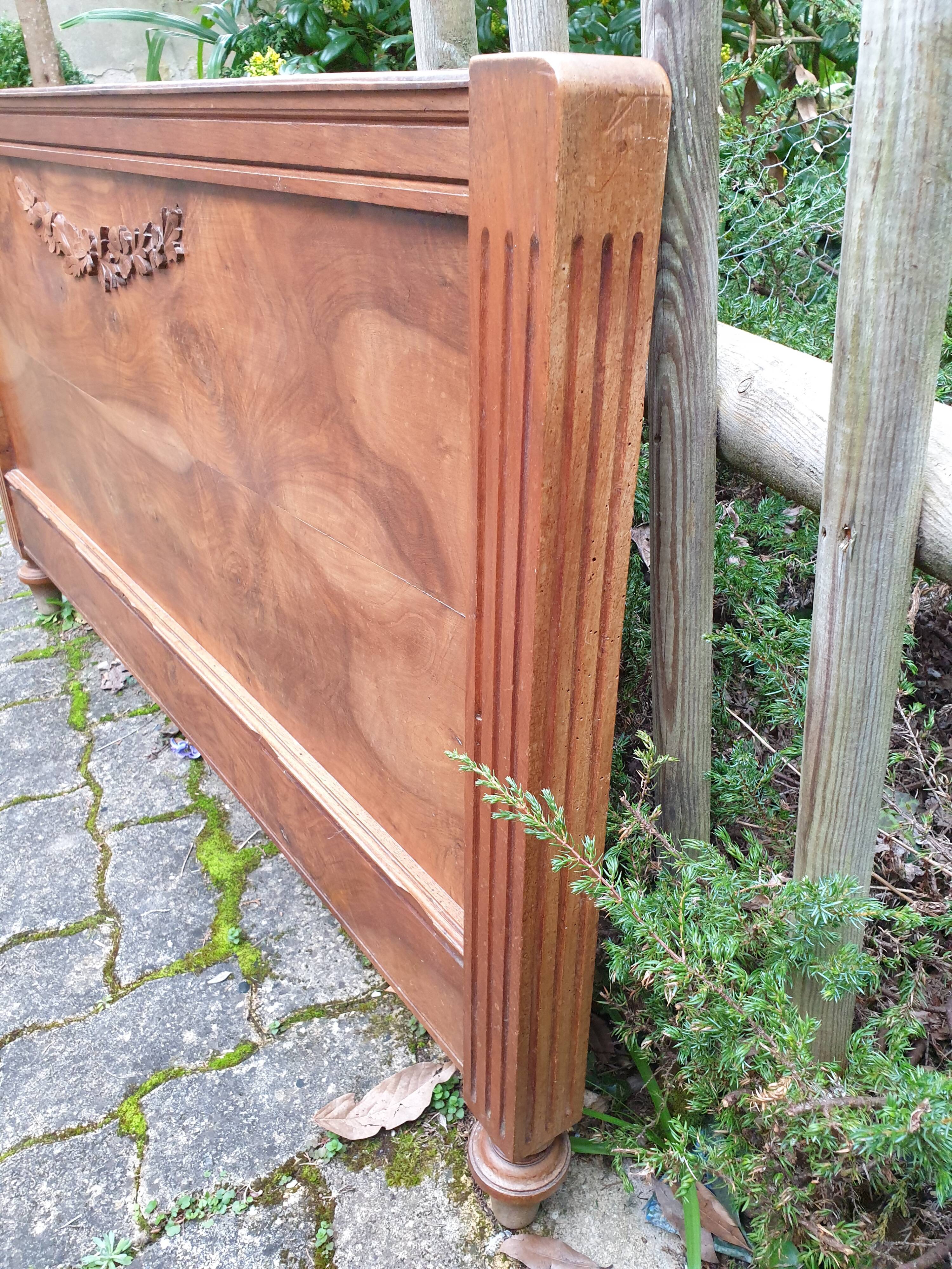 Carved walnut headboard