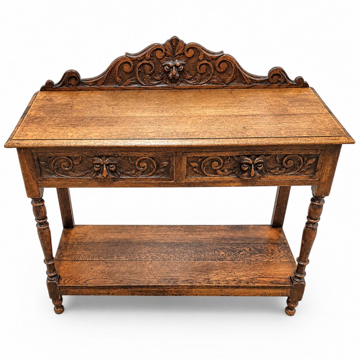 Victorian Gothic Oak side table, decorative carved round 1920. Green Mask decoration
