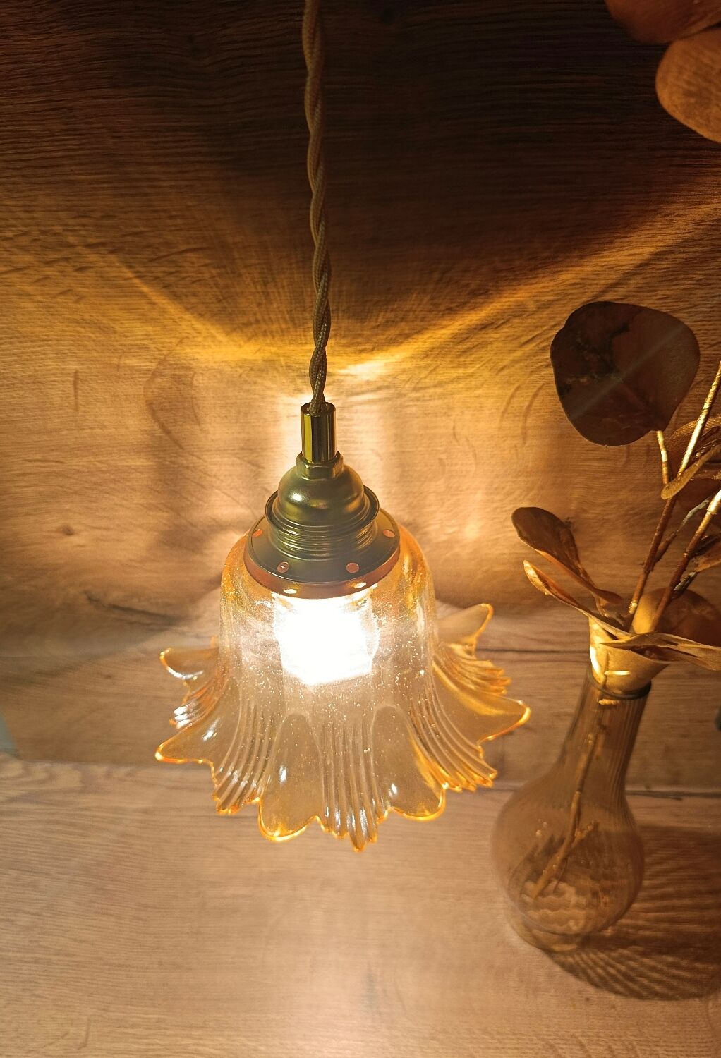 Amber tulip glass portable lamp, golden braided cord.