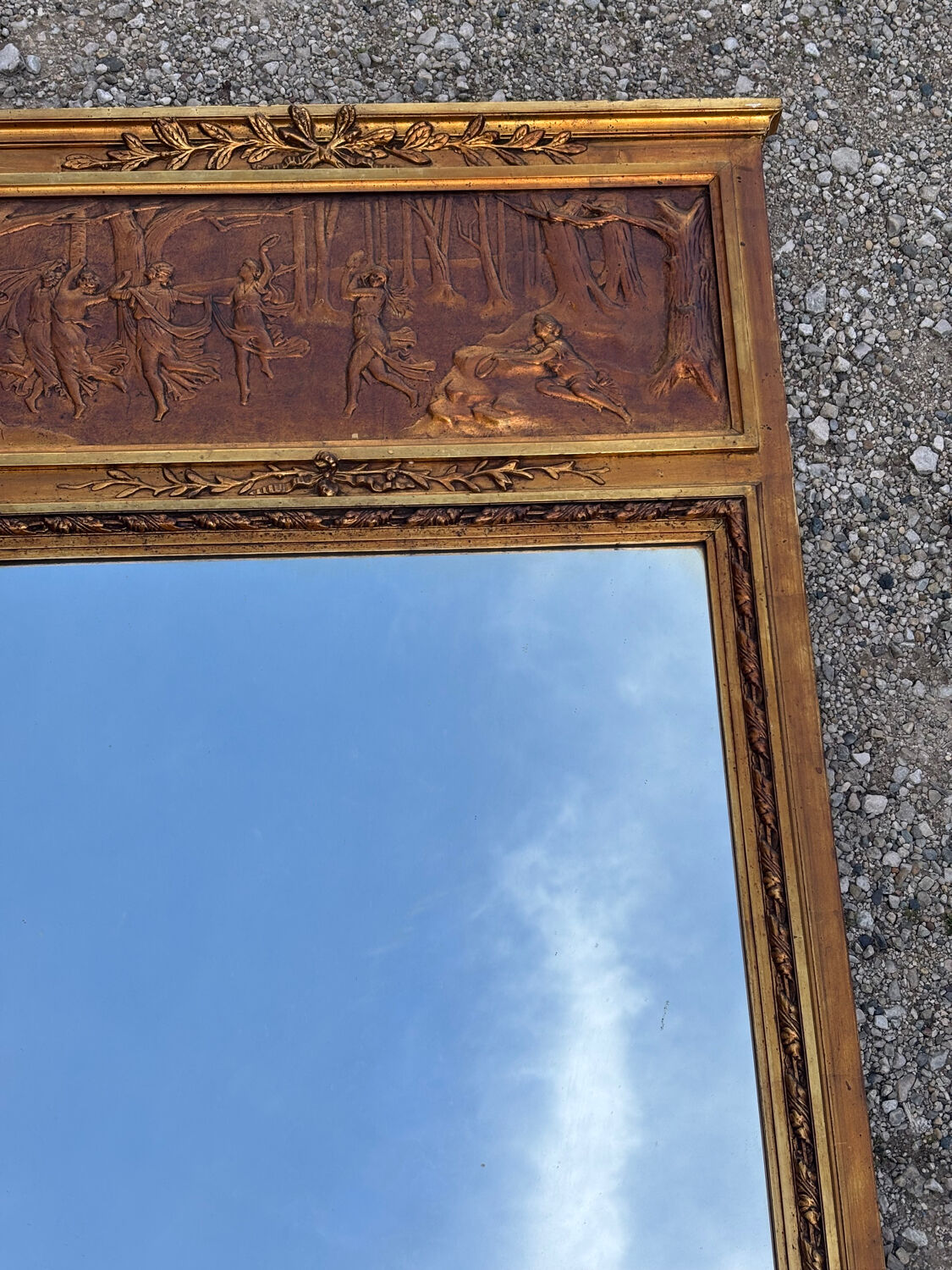 Golden trumeau mirror in Louis XVI style, 20th century.