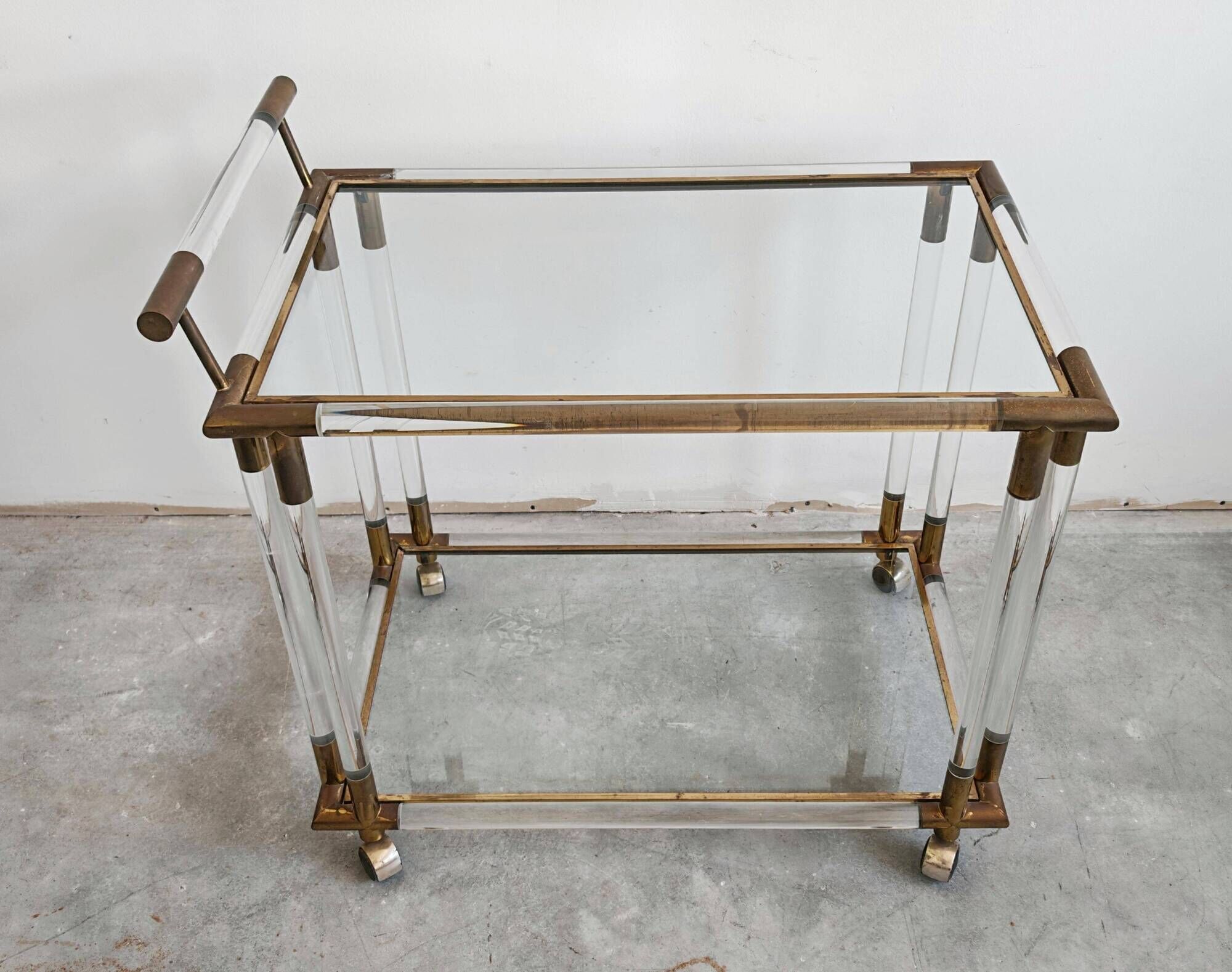 Modern mid-century bar cart in lucite, bronze, and glass, 1970s