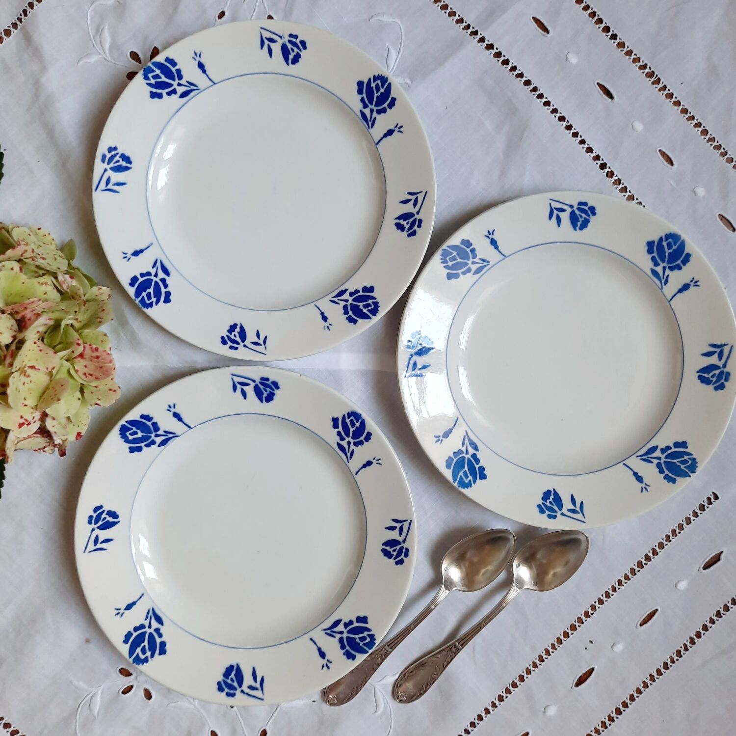 Mismatched old dessert plates accompanied by a dish