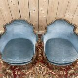Paire de fauteuils bergères de style Louis XV en velours bleu et bois doré