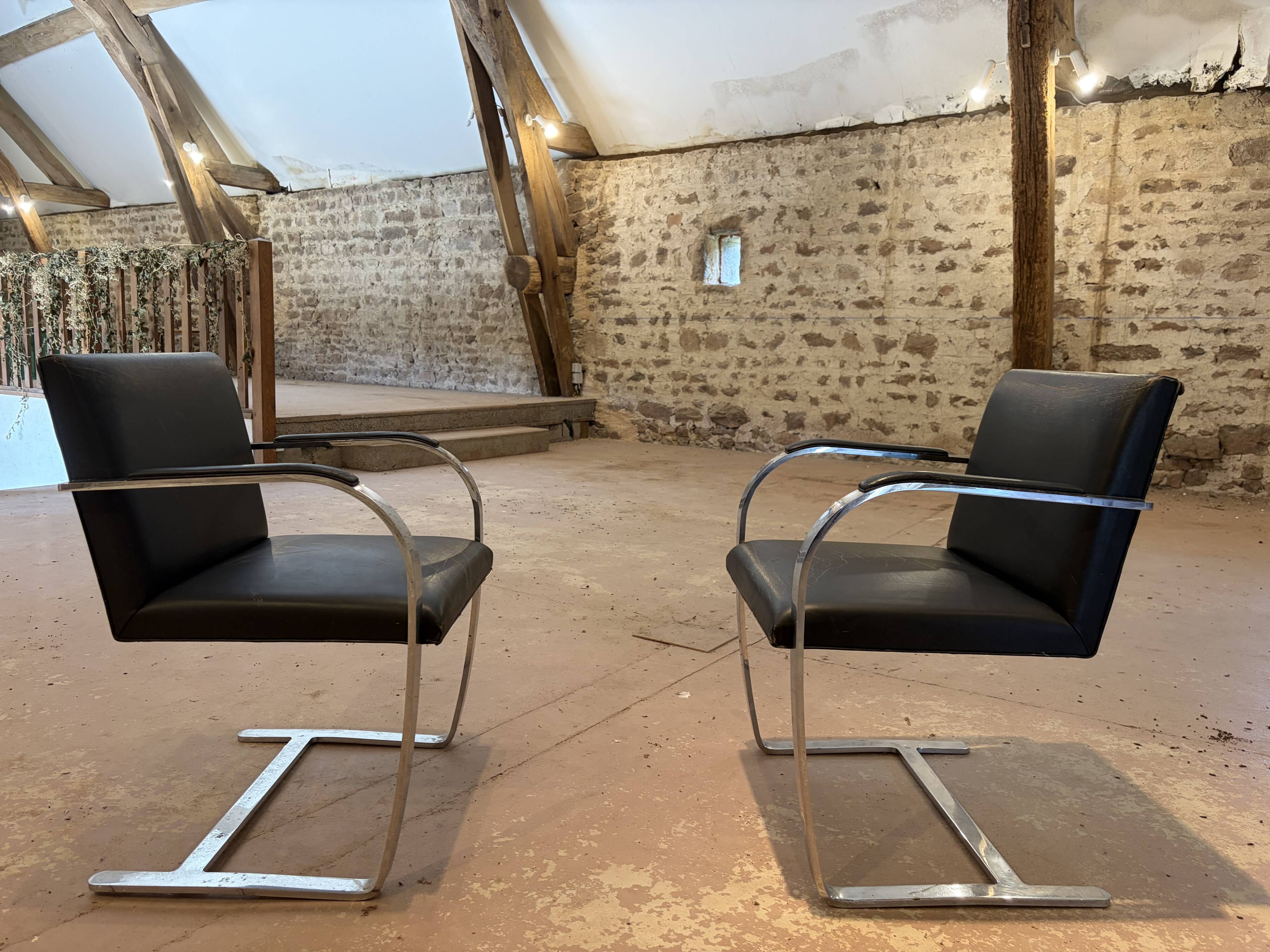 Pair of Executive Chairs by Knoll attributed to Charles Pollock in black leather.