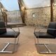 Pair of Executive Chairs by Knoll attributed to Charles Pollock in black leather.