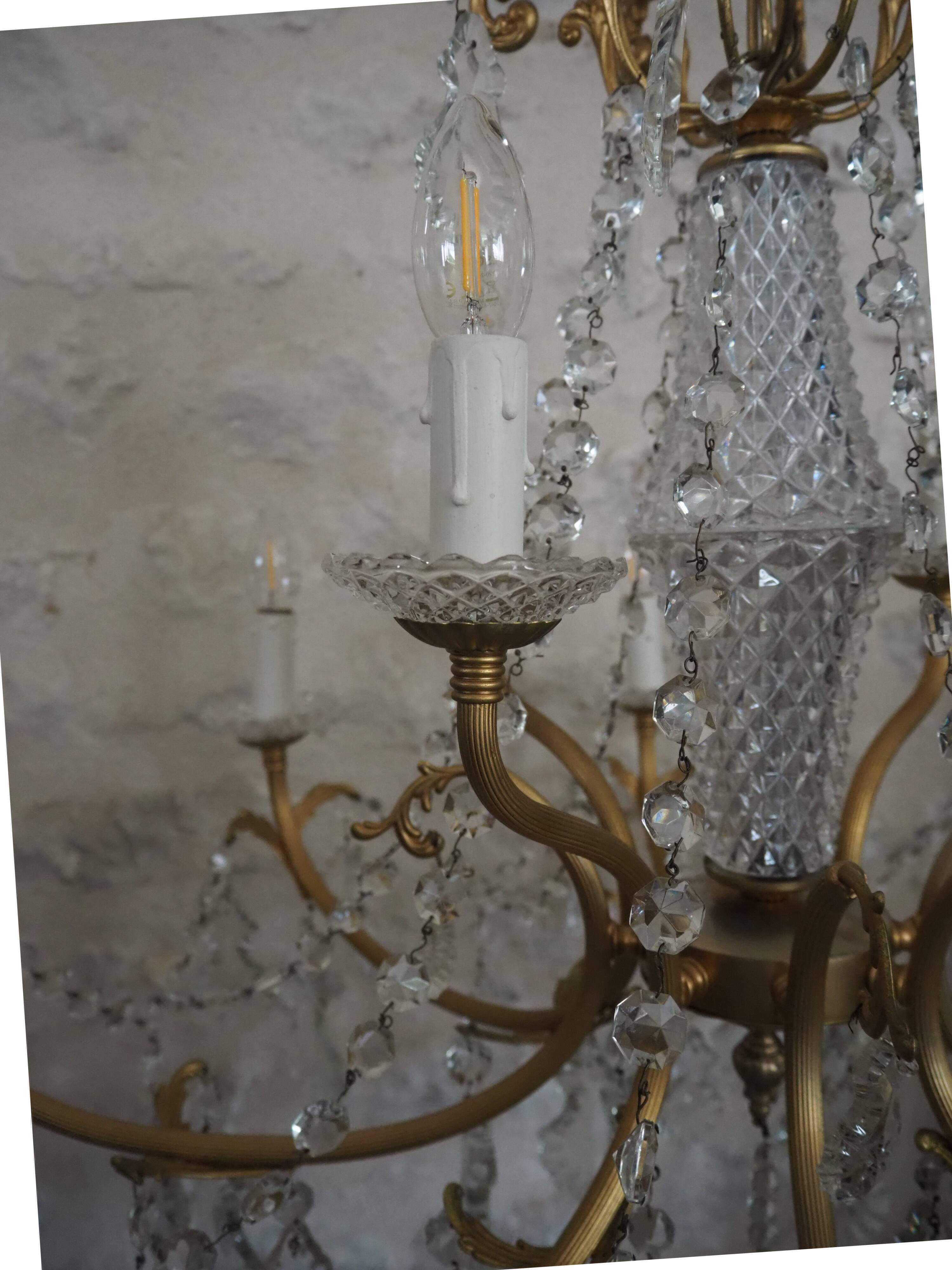 Chandelier 12 lamps with grapevines in crystal, bronze and regulated