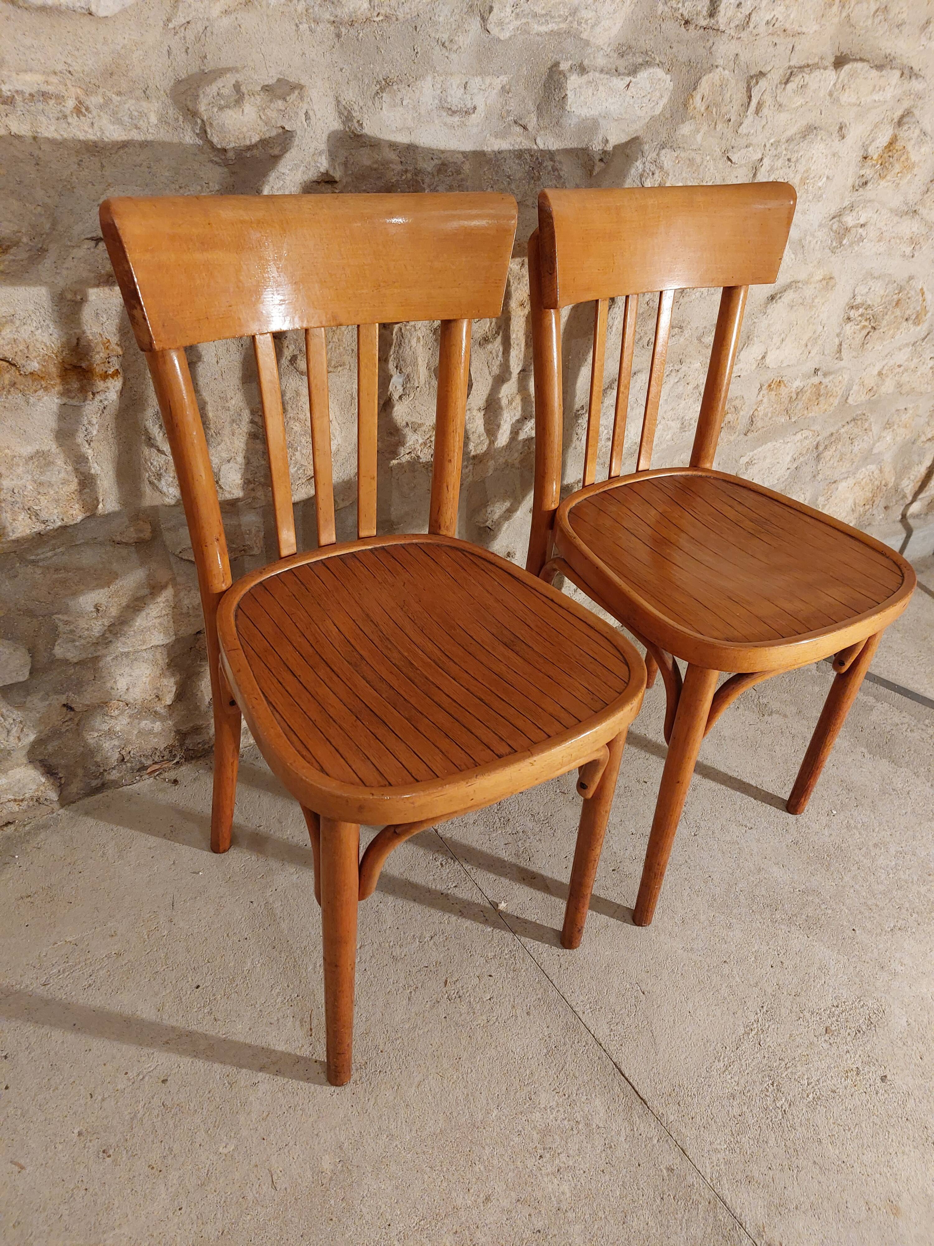 Pair of honey-colored bistro chairs