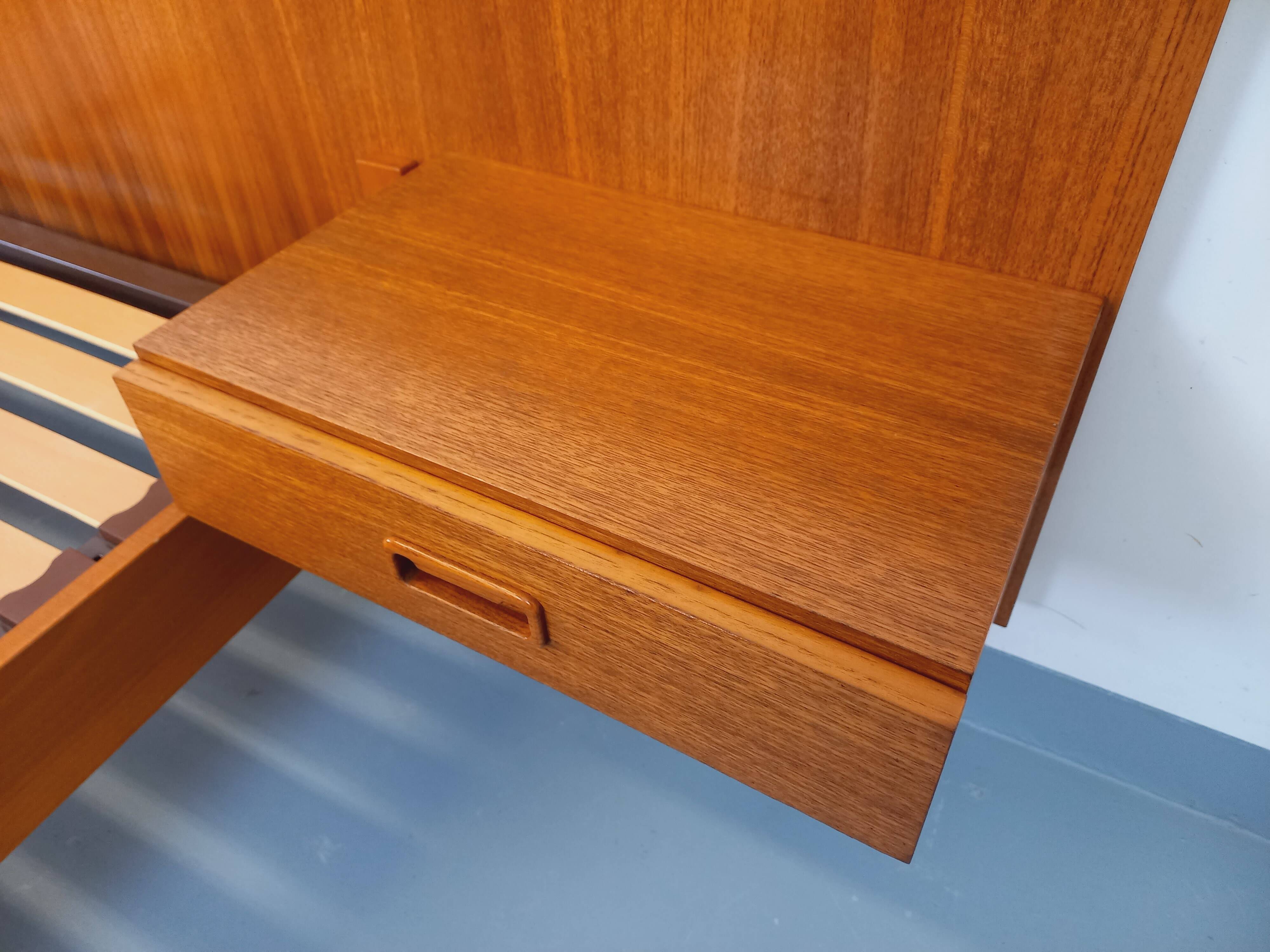 Double bed vintage Scandinavian in teak from the 1960s with integrated bedside tables.