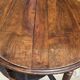 Round dining table with a drop-leaf top in solid walnut, late 19th century.