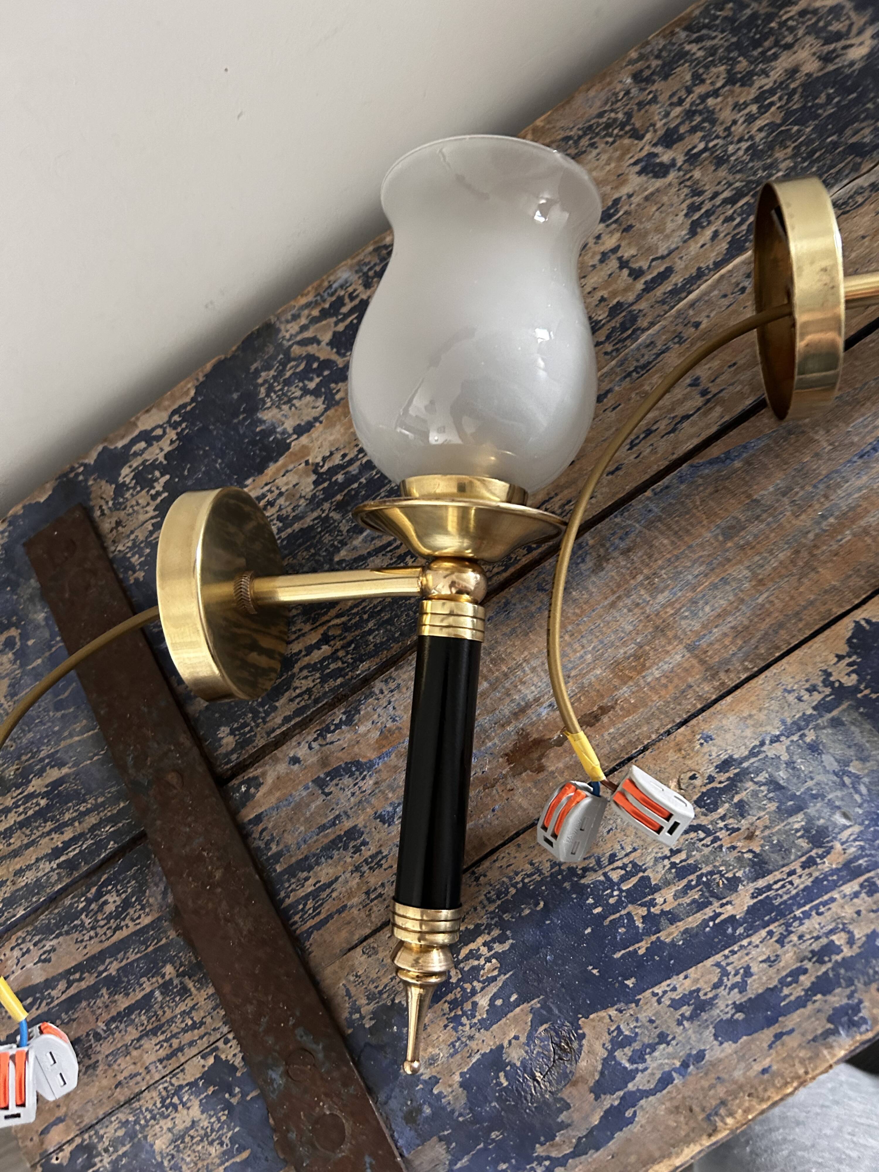 Pair of brass and black torchiere wall lights